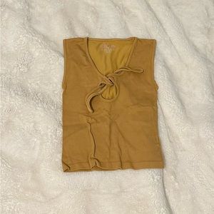 Women’s tank top, golden, very good condition, and size small.